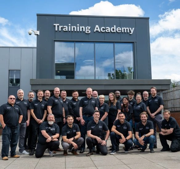 Training team in front of the Worcester Bosch training academy